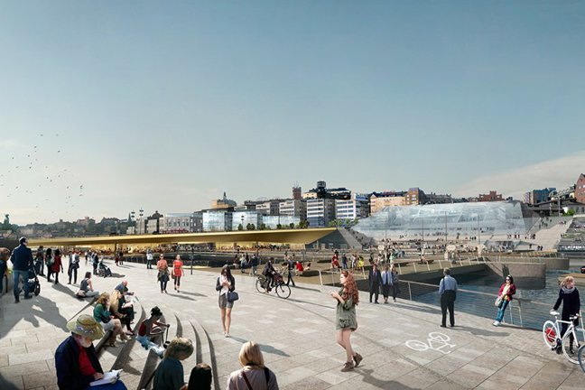 Stadslandskap vid vatten med människor, cyklar och byggnader under klar himmel